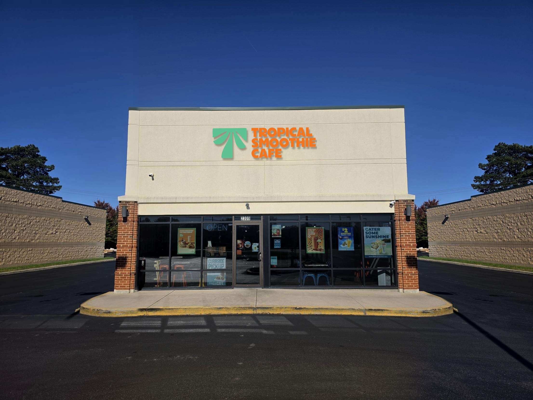 Illustrative Tropical Smoothie storefront refresh concept with teal and orange exterior signage
